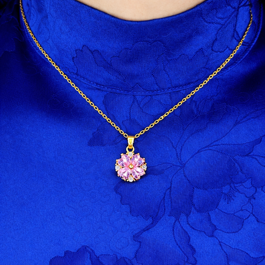 Elegante gouden ketting voor dames met bloemvormige hanger en roze zirkonia