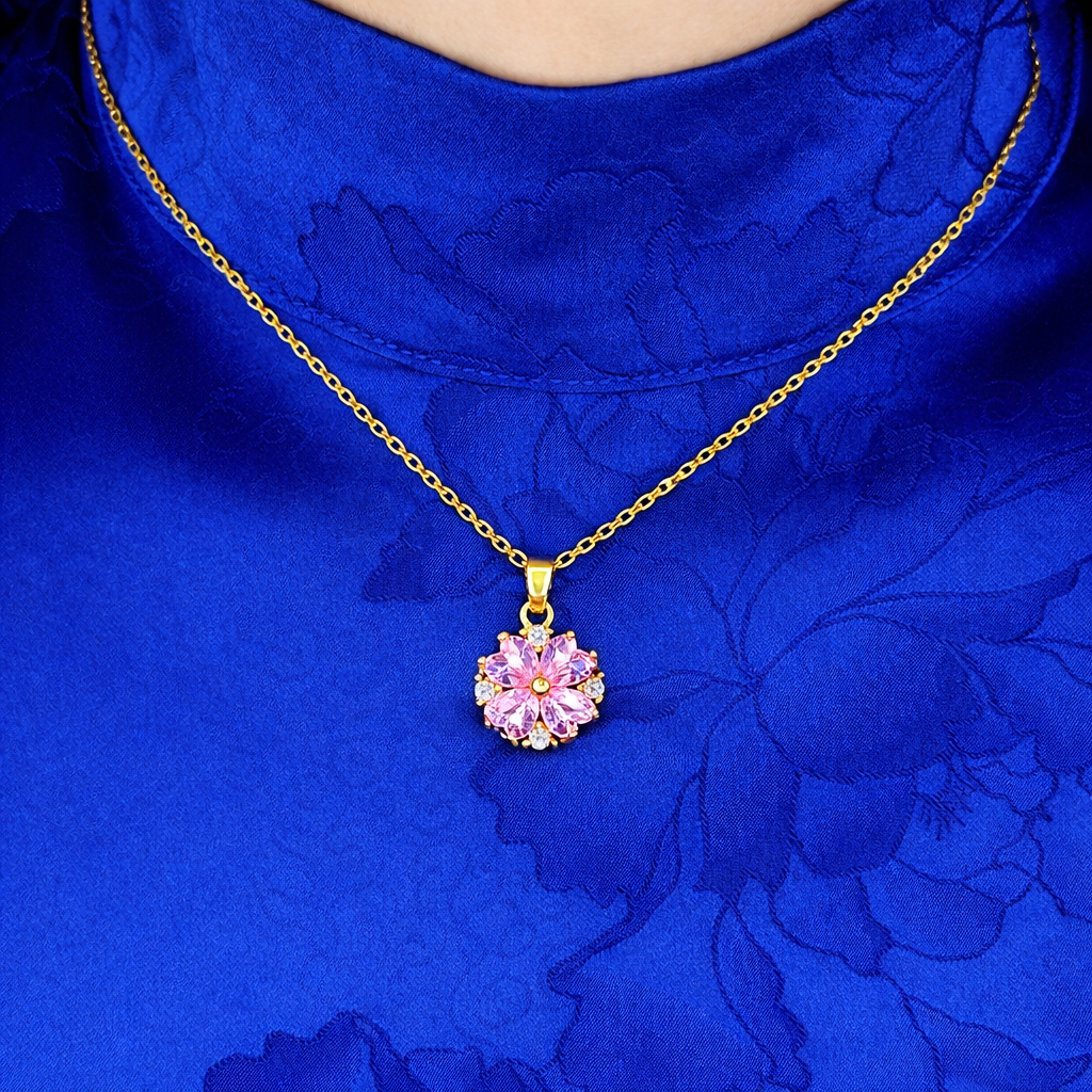 Elegante gouden ketting voor dames met bloemvormige hanger en roze zirkonia